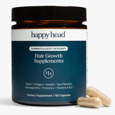 Happy Head hair growth bottle pouring to support daily hair health.