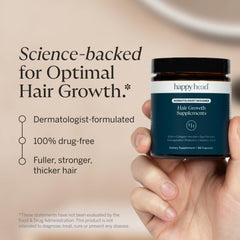 Happy Head hair growth capsules close-up for convenient hair nourishment.