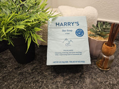 Close-up of Harry's Wildlands blue bars on a wooden surface.