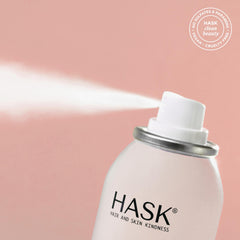 HASK coconut oil nourshing dry shampoo demonstrates root oil absorption for refreshment.