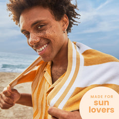 Hawaiian Tropic tanning oil spread creates smooth, glowing skin.