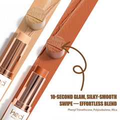 HECI BEAUTY foundation stick swatch on cheek showing light to medium coverage.