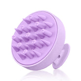 HEETA hair scalp massager in hand with ergonomic non-slip grip for comfortable massage.