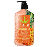 Hempz Biotin Shampoo bottle featuring Sweet Pineapple & Honey Melon, color-safe care for damaged hair.