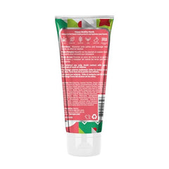 Close-up of Hempz hand cream being applied to hands, showcasing creamy texture.