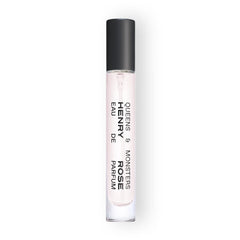 Henry Rose Queens & Monsters travel spray on wrist for on-the-go fragrance touch-ups.