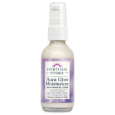 HERITAGE STORE Aura Glow bottle on a clean vanity promotes hydrated, radiant skin.