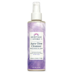 Heritage Store Aura Glow Cleanser bottle shown on a bathroom counter for brightening daily use.