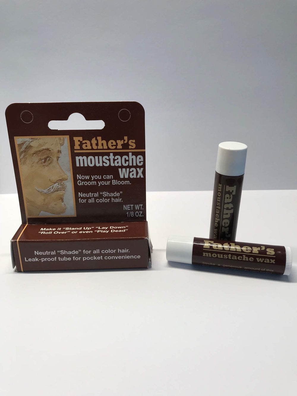 HGFLMR Colonial Dames neutral mustache wax stick in a pocket-friendly, leak-proof tube for all-day hold.