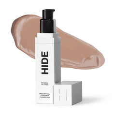 Hide Premium Liquid Foundation bottle in Walnut shade for a natural finish.