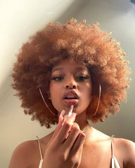 HIHOO short Afro wig with bangs, side view showing natural movement.
