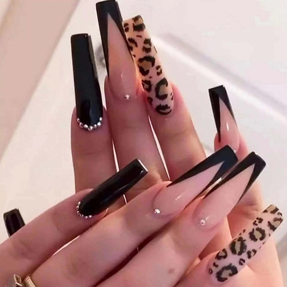 Hkanlre coffin nails with long French leopard rhinestones for a bold salon-style look.