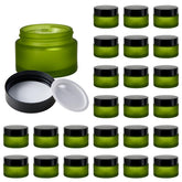 11 Hoa Kinh 1oz green frosted glass jar with lid, perfect for travel lip balms.