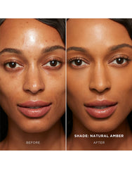 Hourglass Vanish Seamless Finish Foundation Stick being applied with brush for a seamless, natural finish.