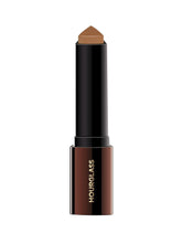 Hourglass Vanish Foundation Stick cap: portable for quick touch-ups.