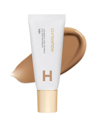 Hourglass Veil Hydrating Skin Tint bottle front shows dewy glow and sheer coverage.