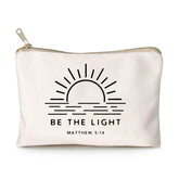 HubbgDesign Be The Light cosmetic bag front view in linen, ideal for travel organization.