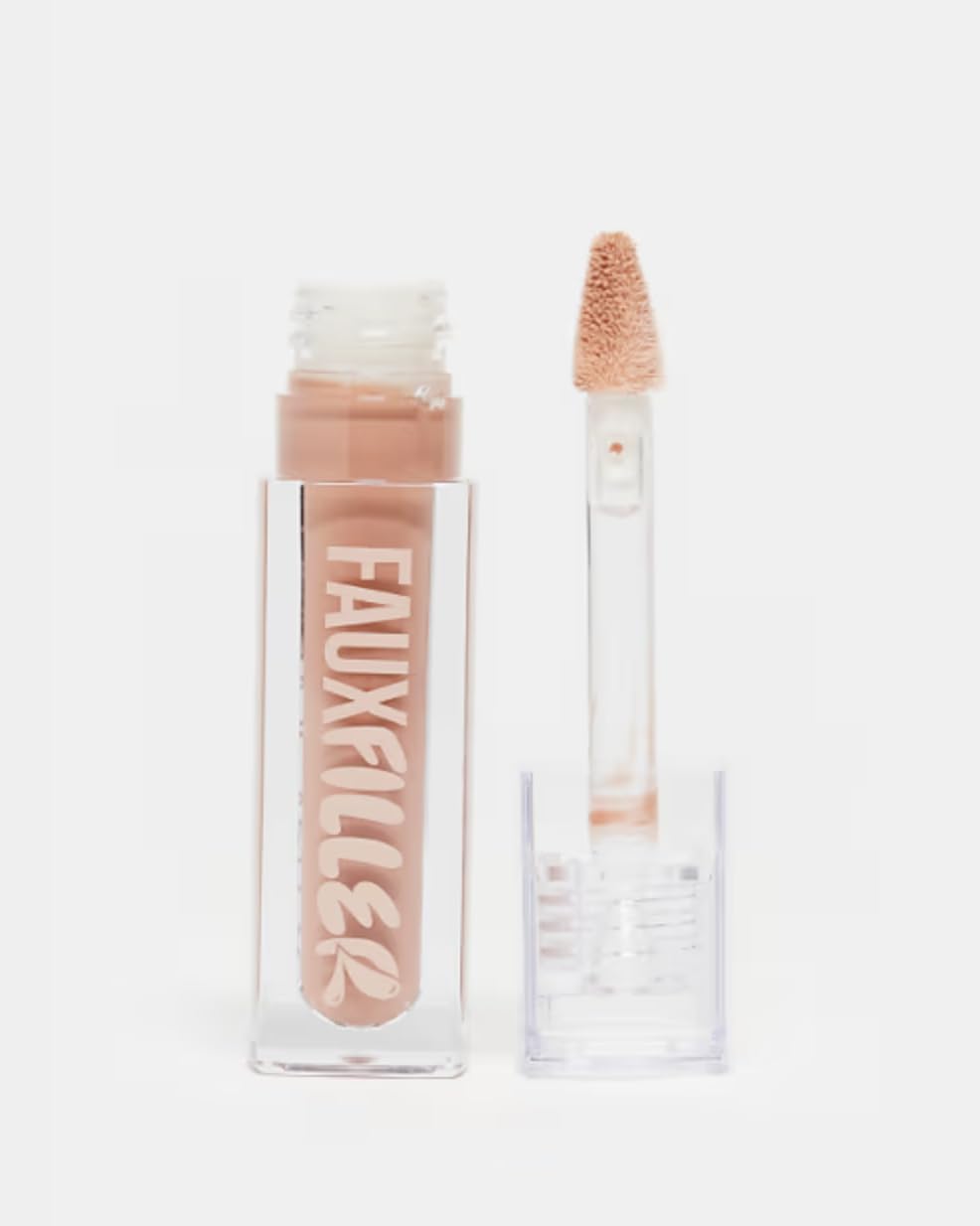 Huda Beauty Faux Filler Extra Shine Lip Gloss in Honey bottle close-up highlights premium shine and hydration.