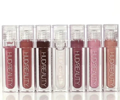 Wand application shot demonstrates smooth glide and non-sticky wear for daily lip gloss rituals.