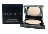 Huda Easy Bake and Snatch Peach Pie powder bottle brightens skin for a natural finish