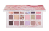 Huda Rose Quartz palette closeup showing rich pigments and smooth texture for blending