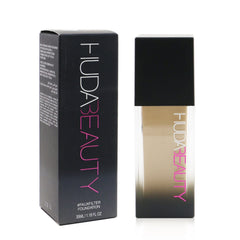 Huda Beauty FauxFilter Cheesecake 250G color swatches showing golden peach undertones