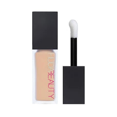 HUDA Beauty FauxFilter Concealer in Coconut Flakes provides crease-proof, long-lasting coverage for dark circles.