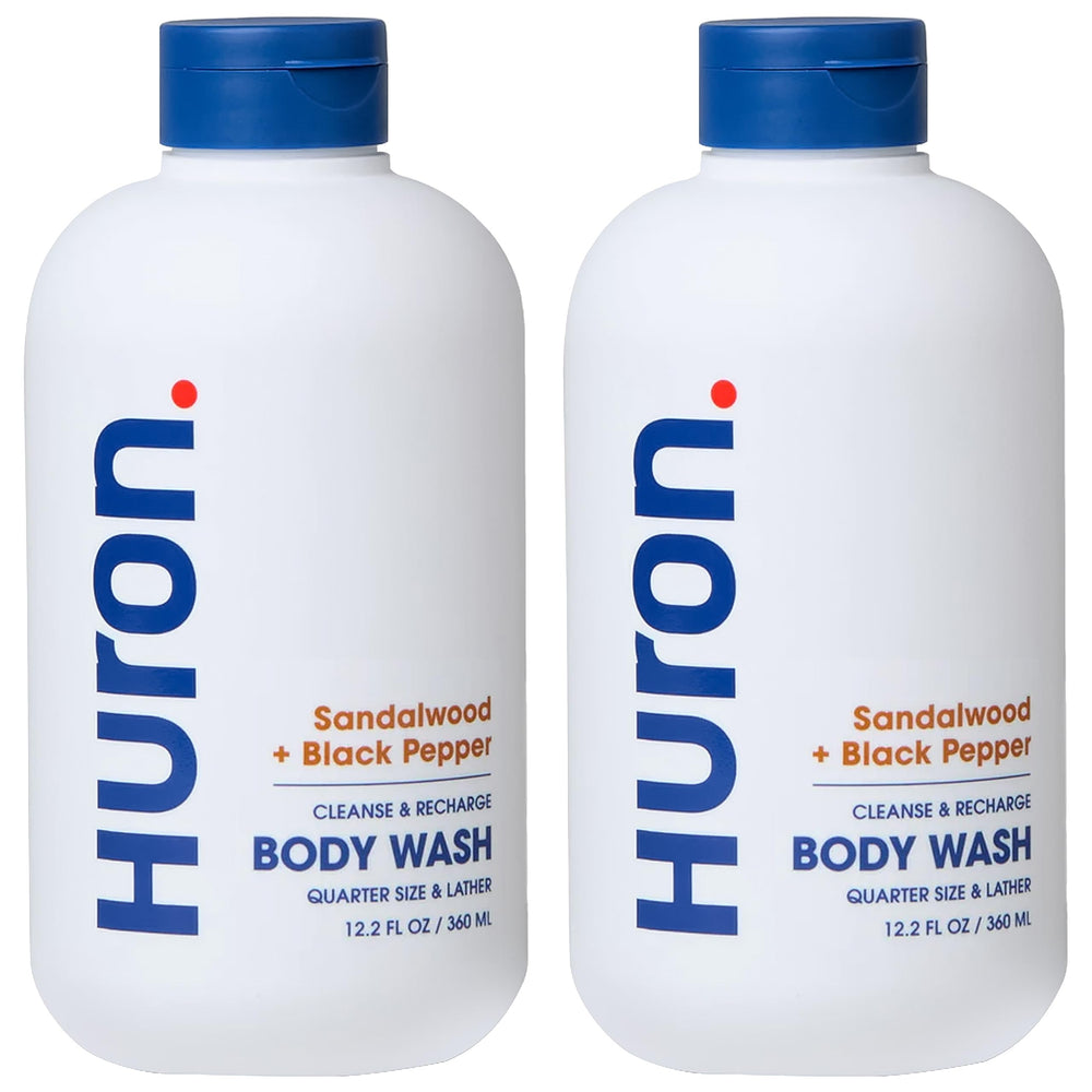 Huron Men's Moisturizing Body Wash bottle front showing woody scent notes for daily freshness