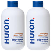 Huron Men's Moisturizing Body Wash bottle front showing woody scent notes for daily freshness