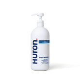 Huron Men's Moisturizing Body Wash bottle with coconut oil for a hydrating cleanse.