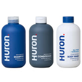 Huron shampoo bottle featuring Sea Salt + Driftwood scent for hydrated hair.