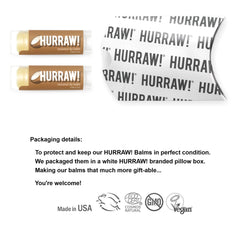 Closeup of Hurraw! Coconut Lip Balm tubes showing texture