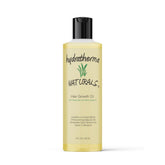 Hydratherma Naturals Hair Growth Oil bottle pouring for lightweight scalp hydration