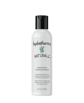 Hydratherma Naturals Herbal Amino Clarifying Shampoo bottle pouring, refreshing cleanse that respects natural oils.