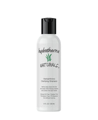 Hydratherma Naturals Herbal Amino Clarifying Shampoo bottle pouring, refreshing cleanse that respects natural oils.