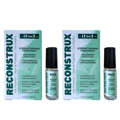 IBD Reconstrux nail repair bottle with brush for daily strengthening.