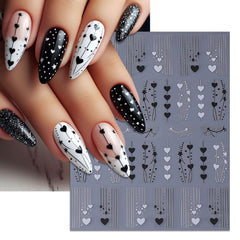 Close-up of IDDFEVE heart-line decals on a nail for a sleek look.