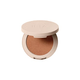 ILIA Lightshift Cream Highlighter in Daze warm copper swatch showing radiant glow.