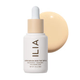 ILIA Super Serum Skin Tint SPF 40 bottle close-up with a dewy finish.