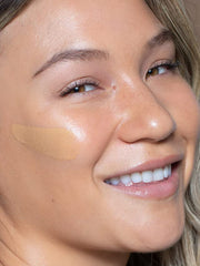 ILIA True Skin Serum Foundation application close-up shows smooth texture blending with skin.