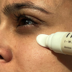 Indie Lee I-Waken serum being gently applied for a refreshed morning look