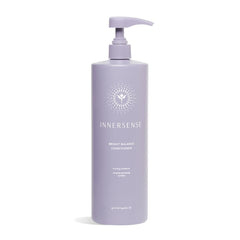 INNERSENSE Bright Balance Purple Toning Conditioner bottle neutralizes brass and cools tones.