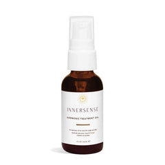 INNERSENSE Natural Harmonic Treatment Oil bottle closeup for hydrated scalp and hair.