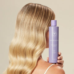 Closeup of INNERSENSE purple-toning shampoo bottle cap and label