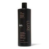 Ion Luxe Shampoo bottle close-up showing premium oil blend.