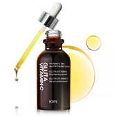 IOPE Gluta Vitamin C Serum bottle with pour for easy application and brightening routine