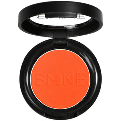 IS'MINE orange matte eyeshadow palette open, showing bold pigment for vibrant looks.
