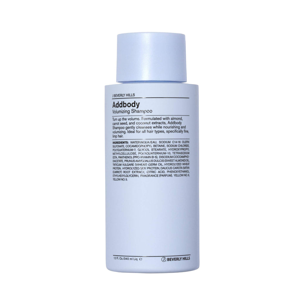 J Beverly Hills Blue Addbody shampoo bottle on bathroom shelf for volumizing cleanse