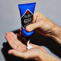 Jack Black Hand Healer jar beside tools highlighting durable protection for calloused skin
