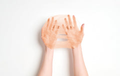 Applying the Rose Blossom Mask for refreshed, revitalized skin.